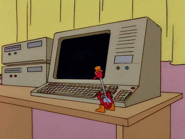The Simpsons drinking bird bobbing down to peck a key on a keyboard